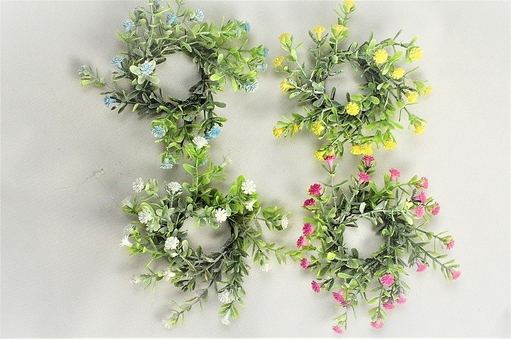 33019 - Delicate Spring flowers and leaves set in a circular floral arrangement. 